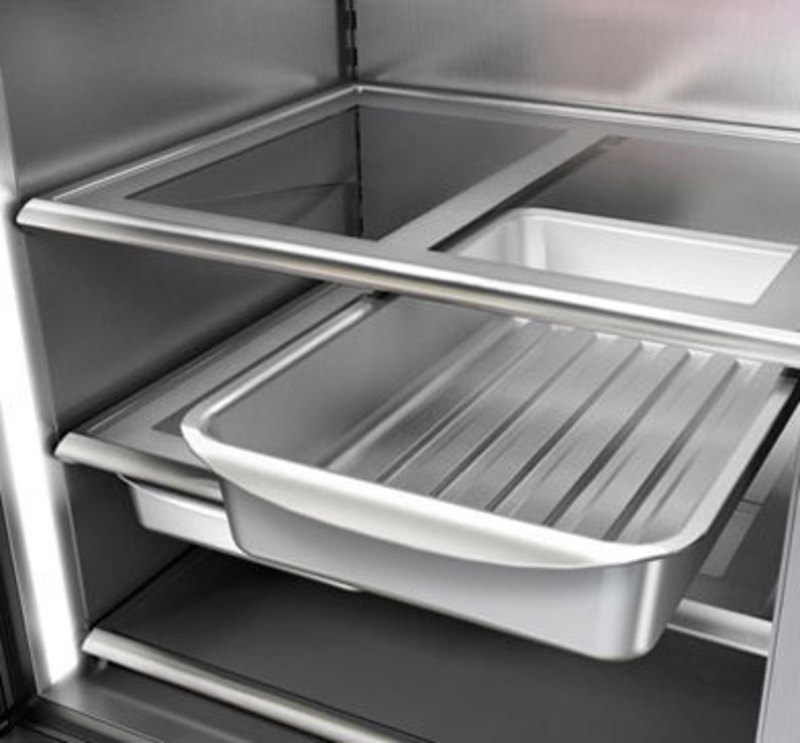 Close up view of a storage bin on the lowest shelf of the refrigerator
