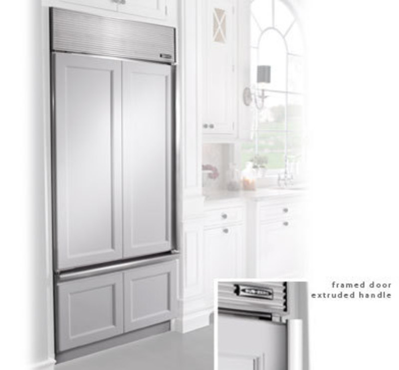 Built in refrigerator with a framed cabinet style covering