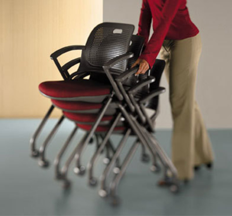 Image showing a user pushing a stack of Get Set Chairs