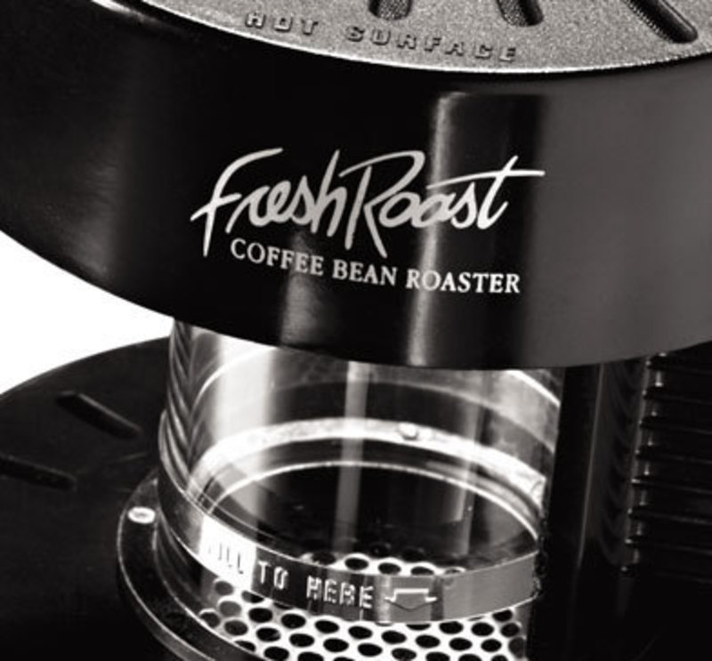 Close up view showing the glass vessel that holds ground coffee beans