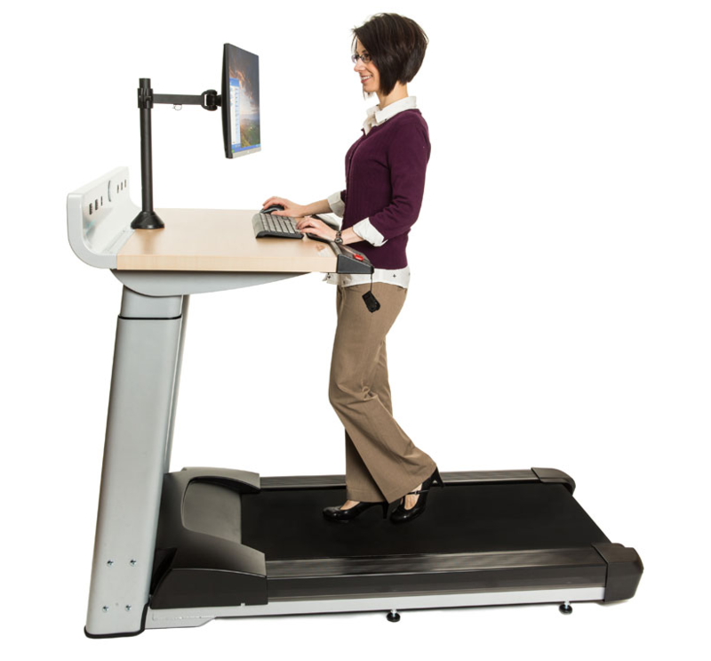 Side view if the InMovement TreadMill Desk showing a person using it