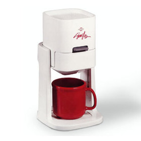 Three quarters front view of the singles coffee maker with a red coffee mug inside