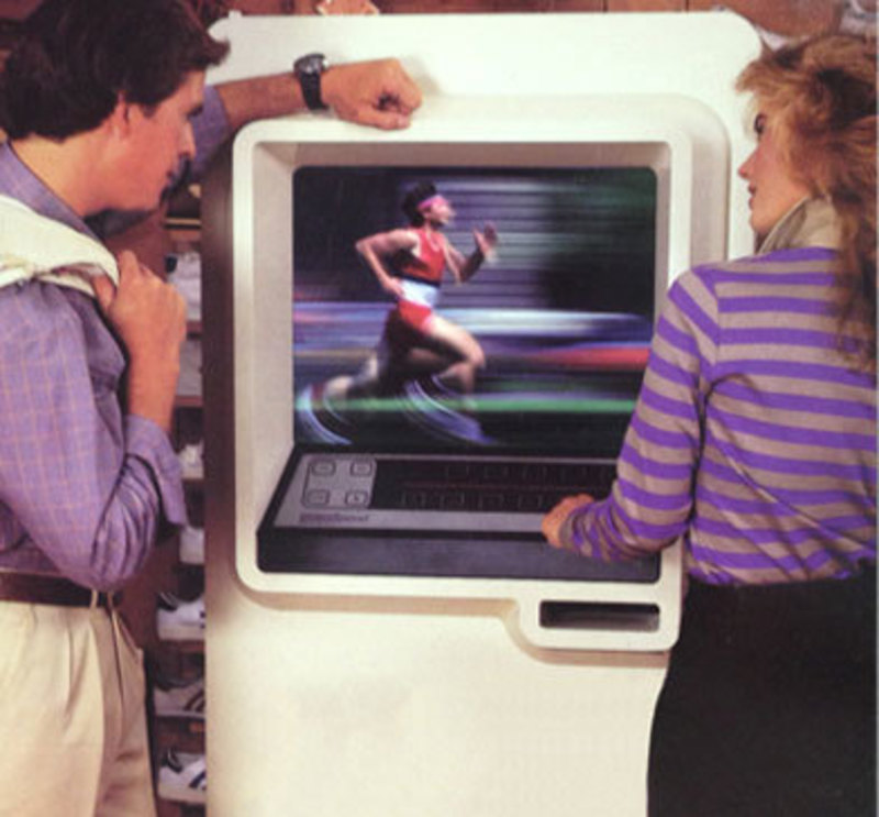 Promotional image showing two end-users using the Videospond kiosk