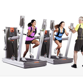 The soft platform training machine with people engaged in a running exercise