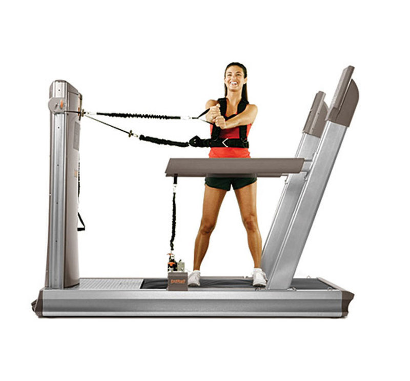 The soft platform training machine with a person engaged in a extension exercise