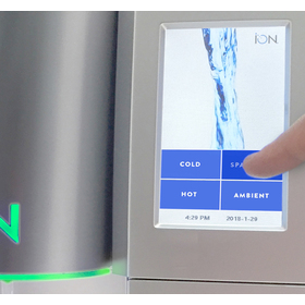 Close up of the ION water cooler control screen dispensing sparkling water