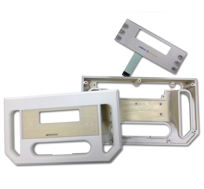 Summit Industries: Advantage DFMT for AmRad Medical Overhead view showing the machined font and back halves of the enclosure with the prototype membrane switch